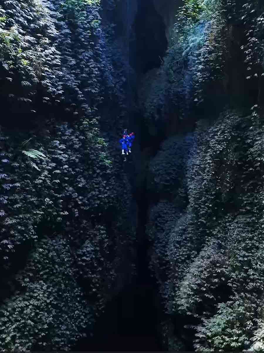 Abseiling in cave New Zealand