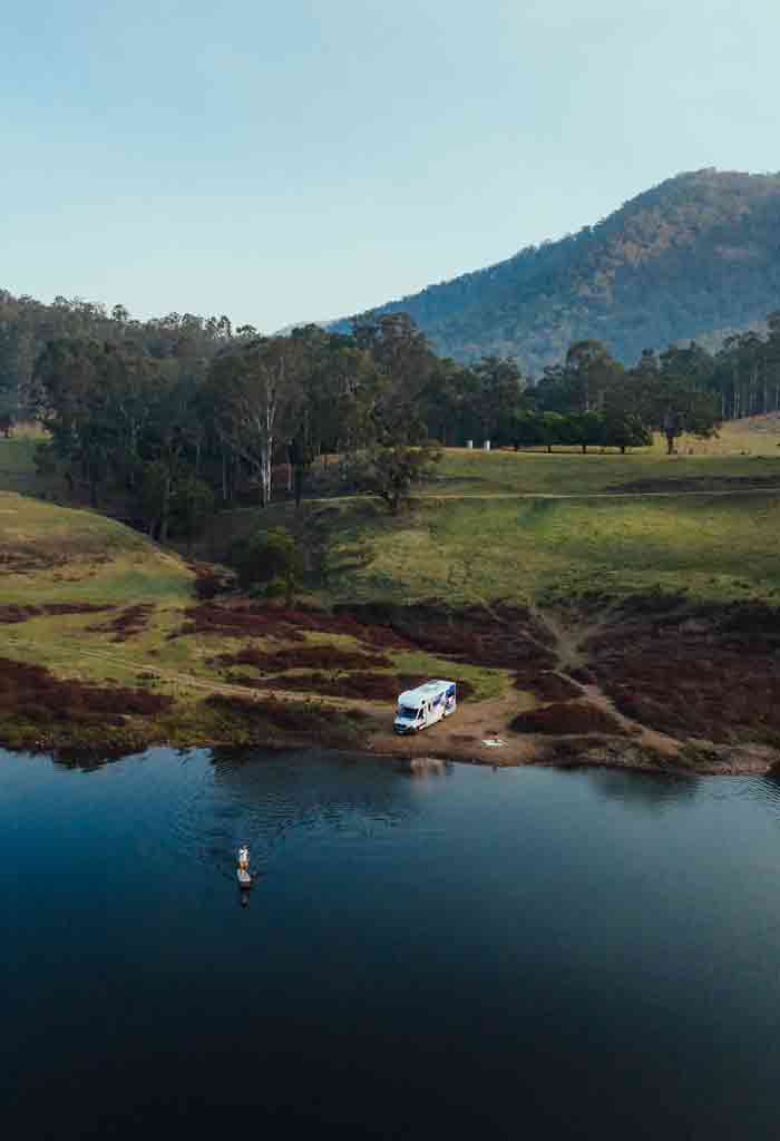 Motorhome parked near large New Zealand lake