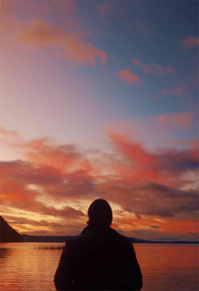 Silhouette of man at sunset